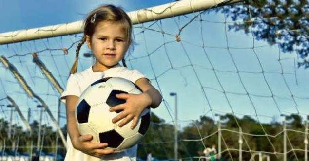 Young-Girl-Playing-Soccer-Goalie
